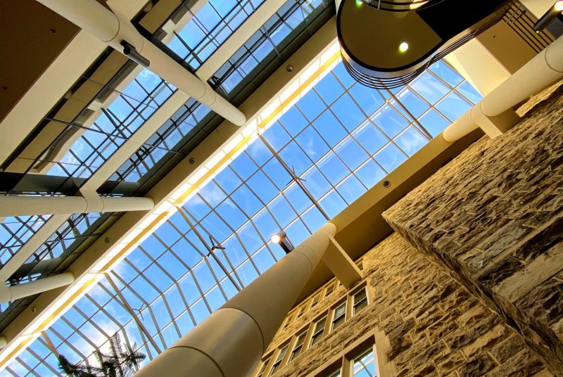 The morning sun illuminating Pamplin Hall.