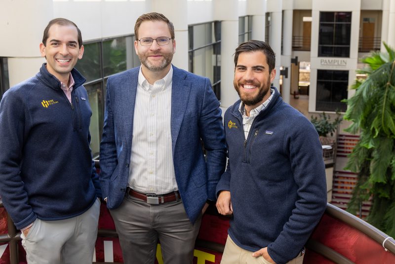 Alex Nette ’10 (left) and Michael Cardman ’11 (right) with Joe Simpson (center).